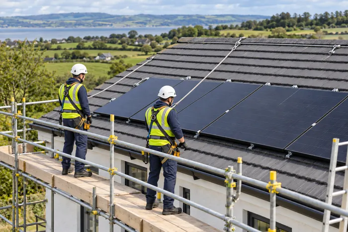 Solar panels being installed on a roof